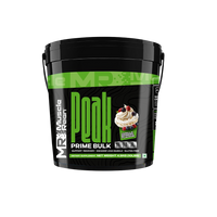 Muscle Reign high protein weight gainer supplement in a black bucket with green label and cupcake design.